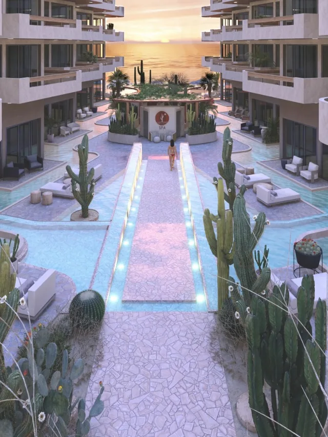 Oasis Ananta — el corredor de albercas al anochecer